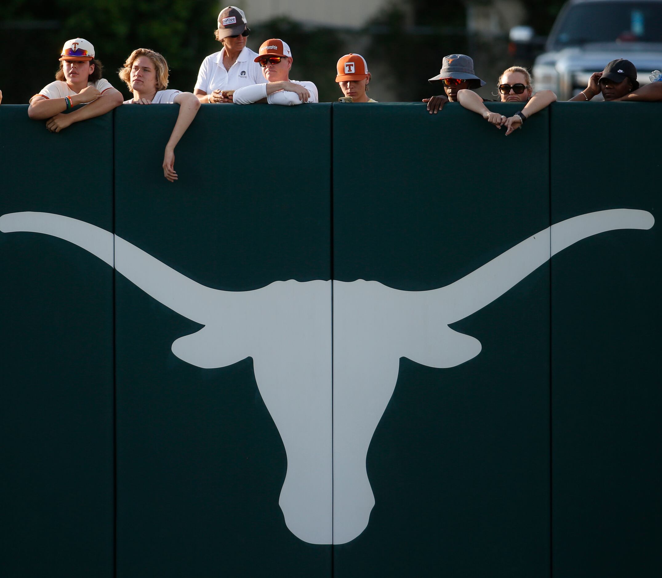 Fans watch from over the left field wall during the 7th inning of play between Aledo and...