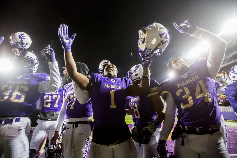 The James Madison football team celebrates their win over Sam Houston State after the NCAA...