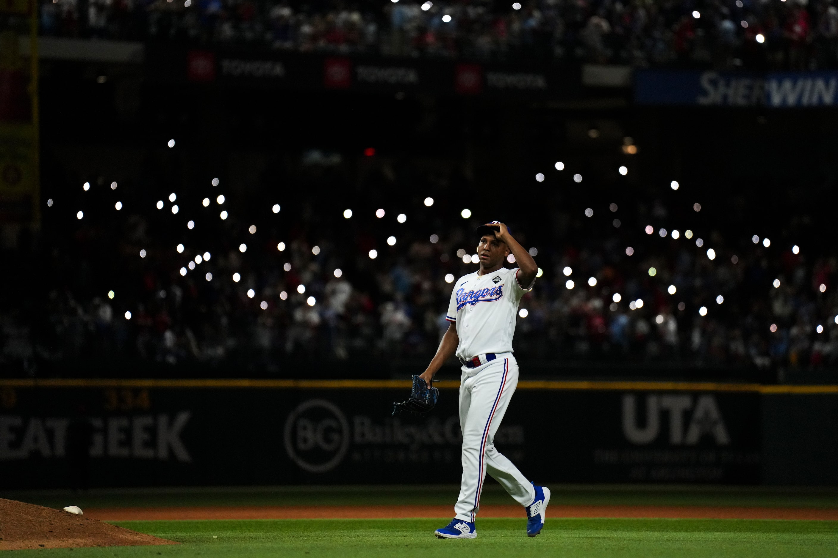 Texas Rangers relief pitcher Jose Leclerc enter the game during the tenth inning in Game 1...