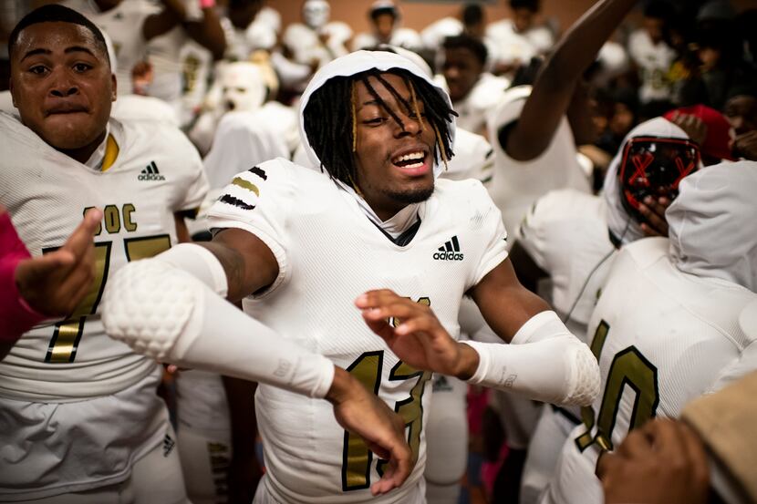 South Oak Cliff junior Taylor Starling (13) celebrates with his teammates during halftime of...