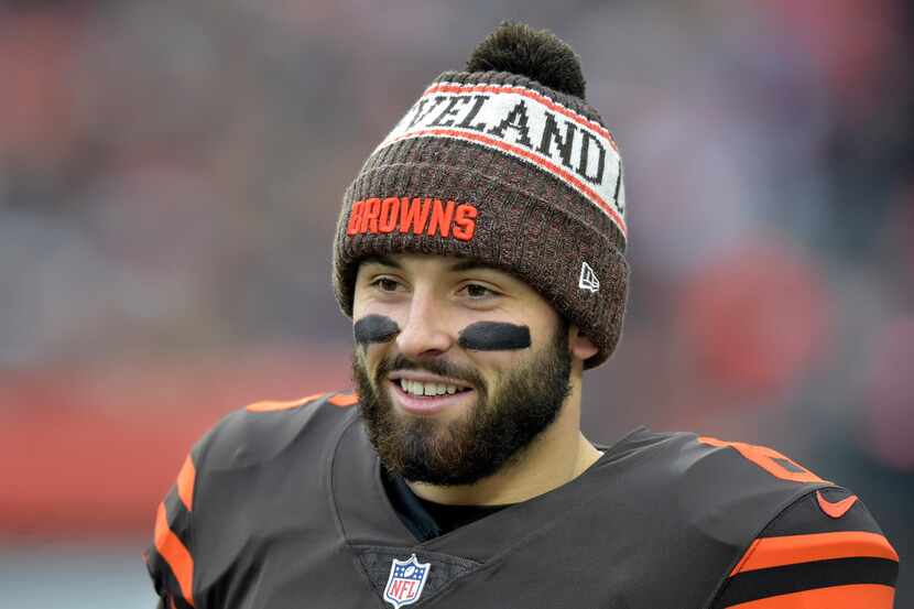 Cleveland Browns quarterback Baker Mayfield smiles during half time of an NFL football game...