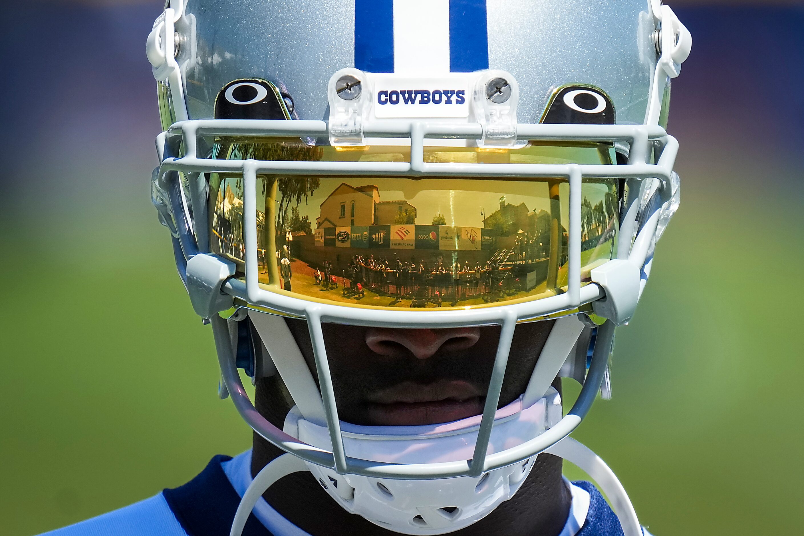 Fans and media are reflected in his visor as Dallas Cowboys wide receiver Michael Gallup...