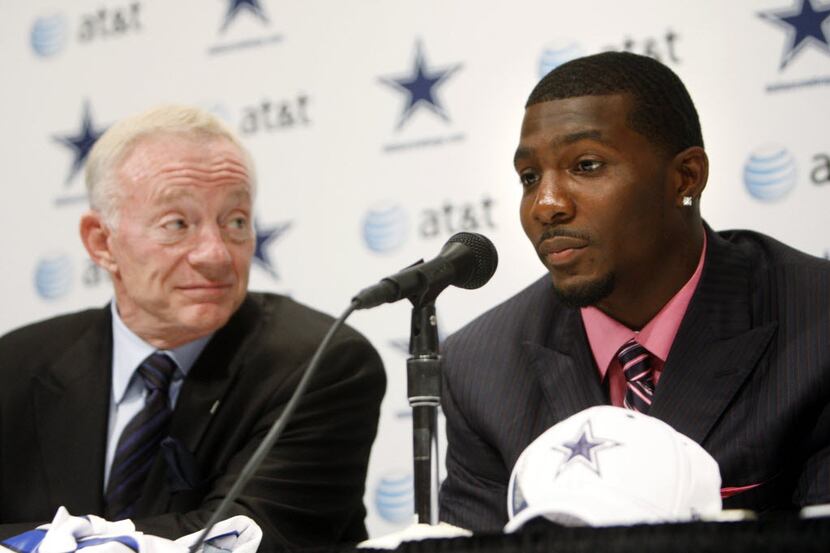 Dallas Cowboys first round draft pick Dez Bryant answers questions as Cowboys owner Jerry...