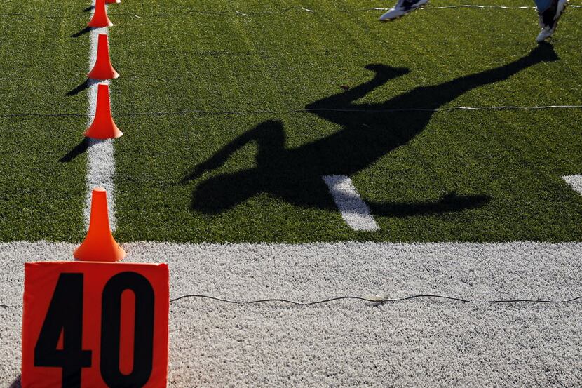 A player runs a timed 40-yard dash during the Nike+ Football The Opening Dallas Regional...
