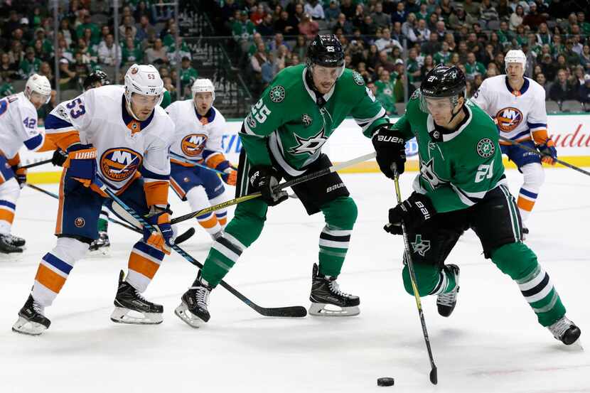 New York Islanders' Casey Cizikas (53) and Dallas Stars' Brett Ritchie (25) watch as left...