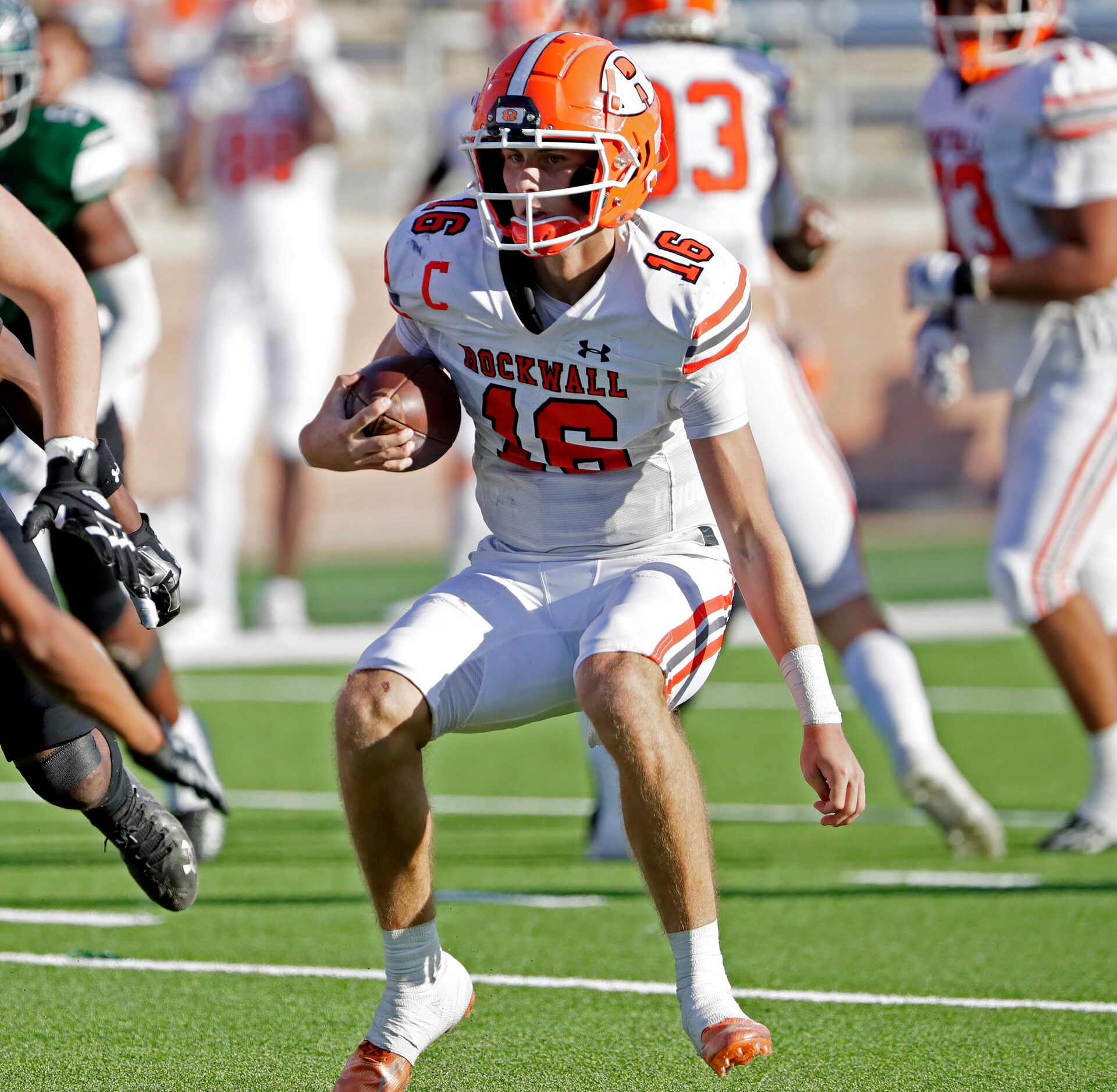 Rockwall High School quarterback Mason Marshall (16) runs the ball during the second half as...