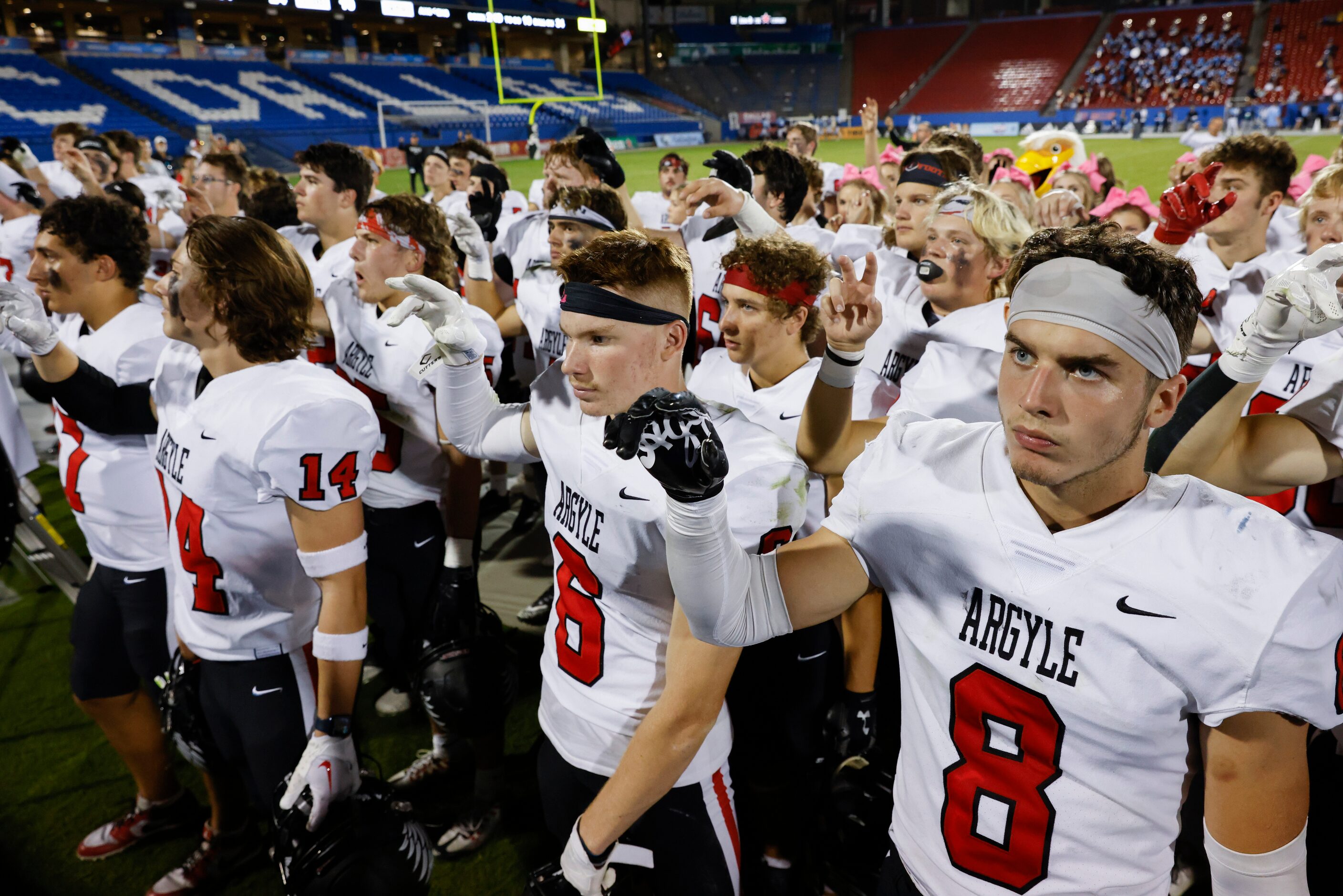 Argyle high players celebrate after winning against Emerson during a football game at Toyota...