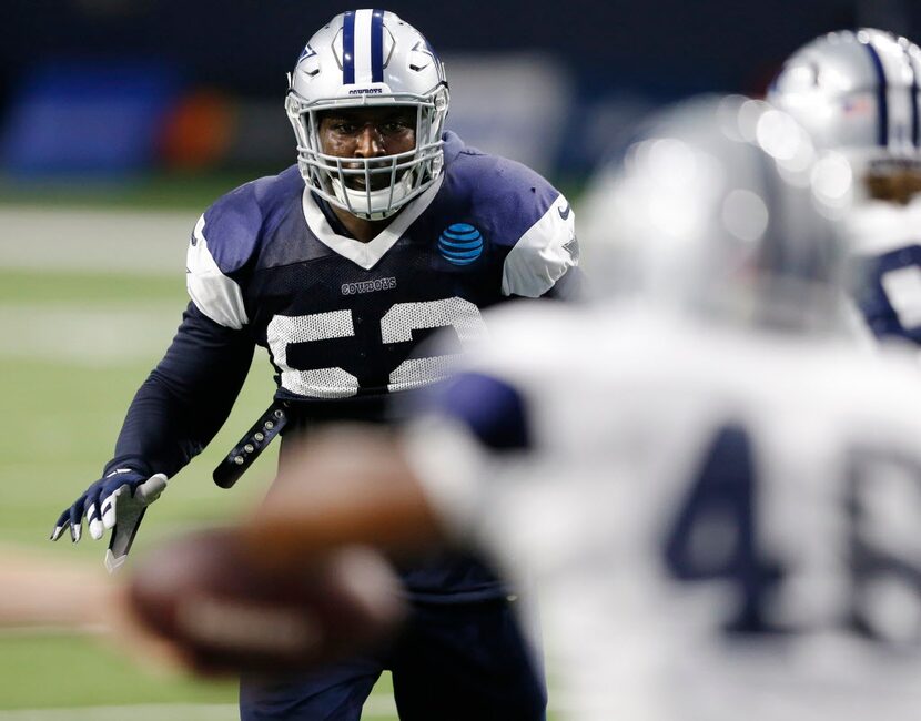 Dallas Cowboys linebacker Justin Durant (52) keeps his eyes on Dallas Cowboys running back...