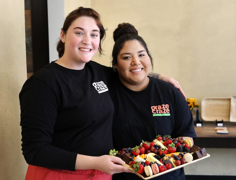 Kenzie Bedore, left, and Lori Gutierrez work at Graze Craze in Plano.