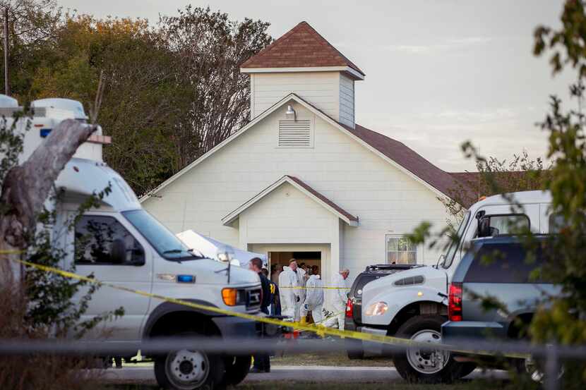 Investigators worked at the scene of the deadly shooting at the First Baptist Church in...