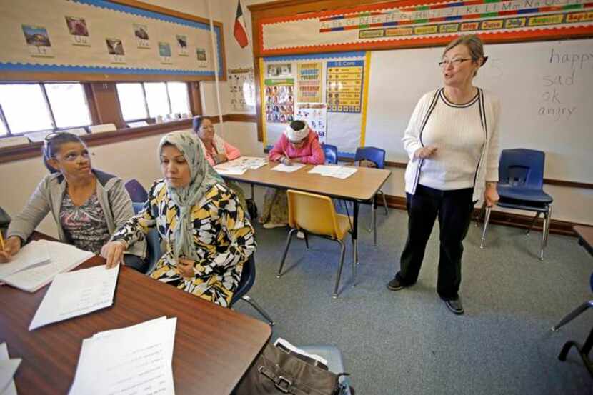 
Teacher Teresa Price instructs as (from left) Maria Figueroa of the Dominican Republic,...