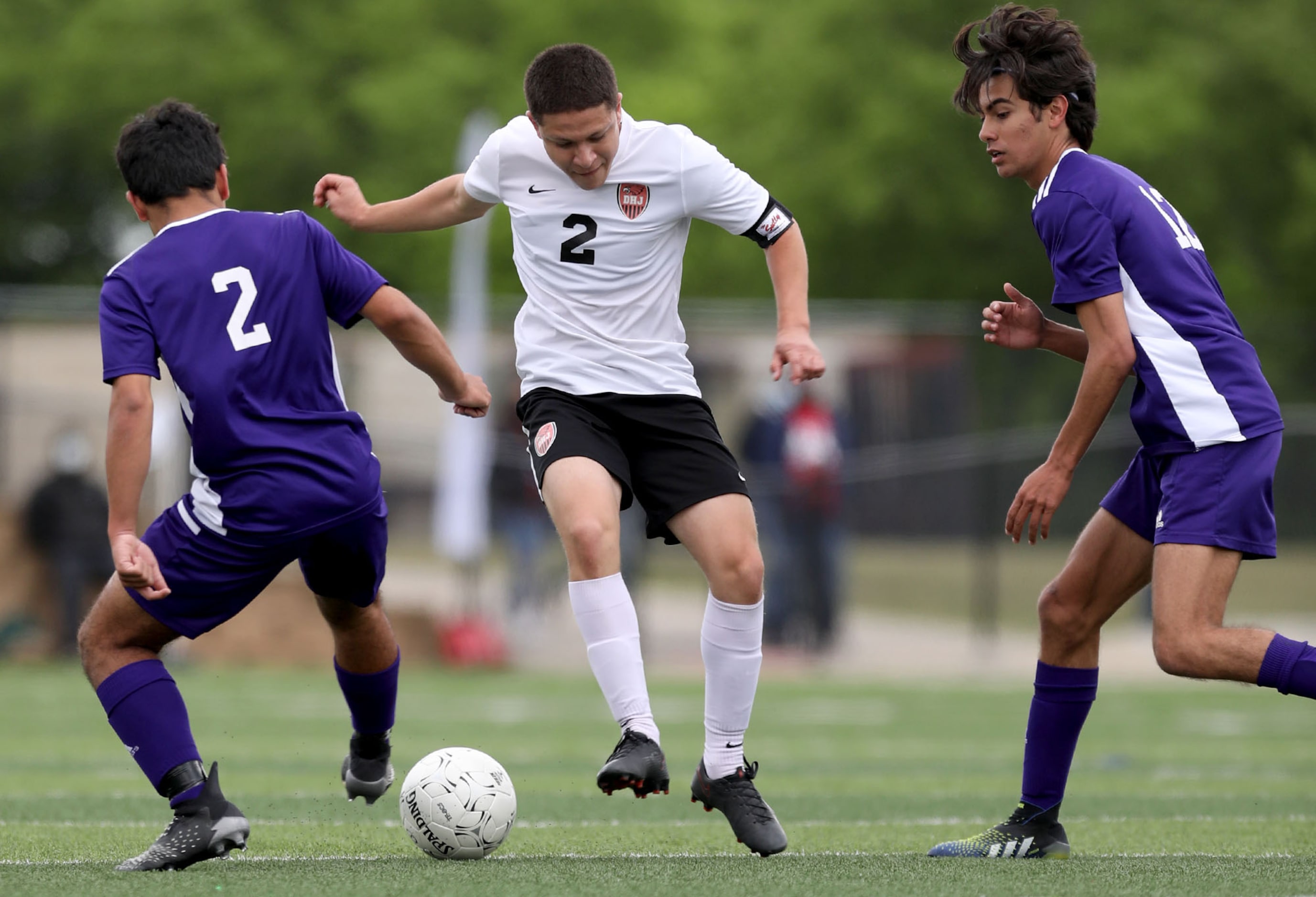 Fort Worth Diamond Hill-Jarvis' Hector Ramirez (2) looks for room between Boerne's Jess...