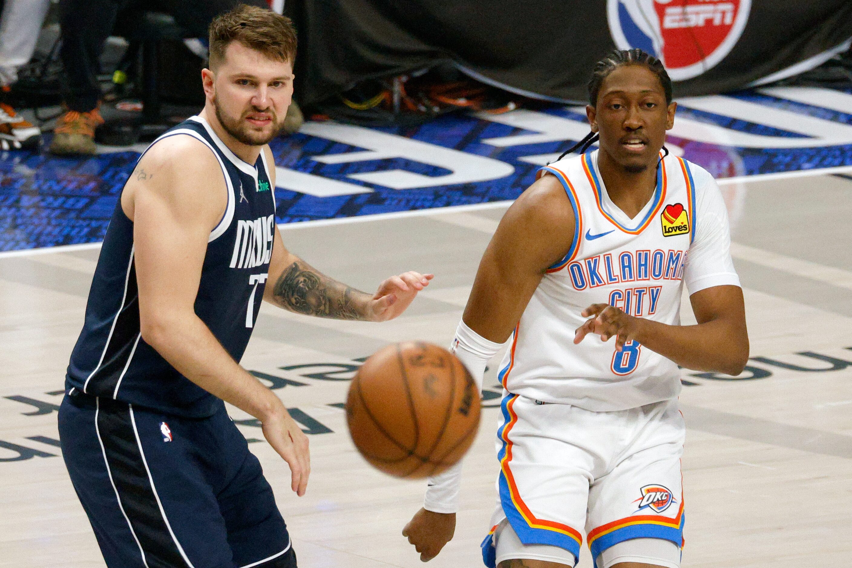 Dallas Mavericks guard Luka Doncic (77) and Oklahoma City Thunder forward Jalen Williams (8)...