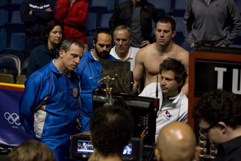 
“Foxcatcher” director Bennett Miller (seated, right, with, from left, Steve Carell, Mark...