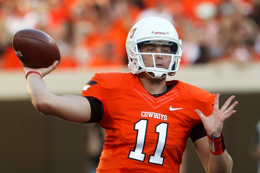 Oklahoma State quarterback Wes Lunt throws against Savannah State during the first quarter...