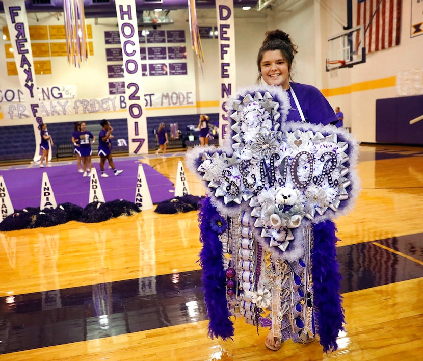 Alvarado High senior Brittany Eicker wore a 'Texas-sized' mum  to their homecoming pep...