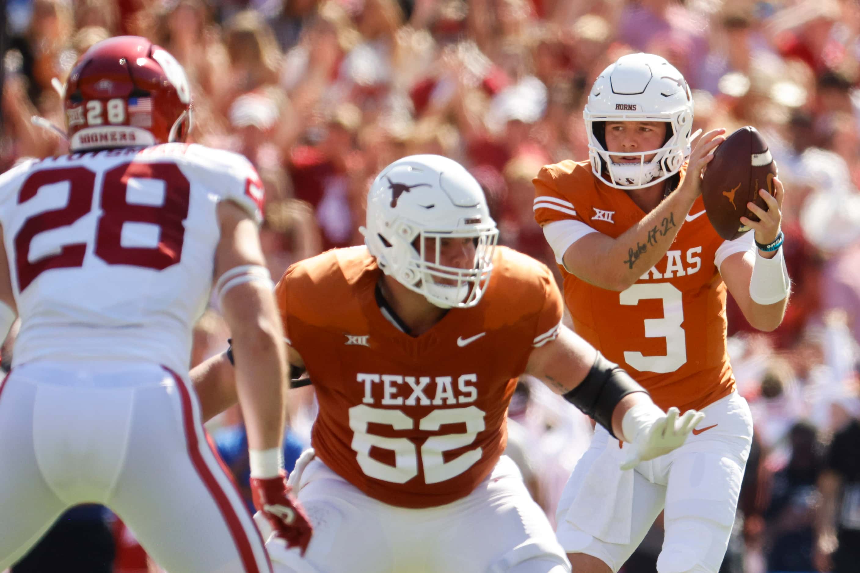 Texas quarterback Quinn Ewers (right) receives to throw the ball against Oklahoma during the...