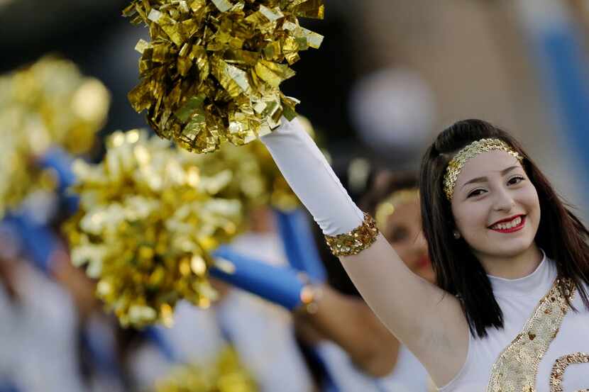 TXHSFB A Conrad drill team member performs before the first half of a high school football...