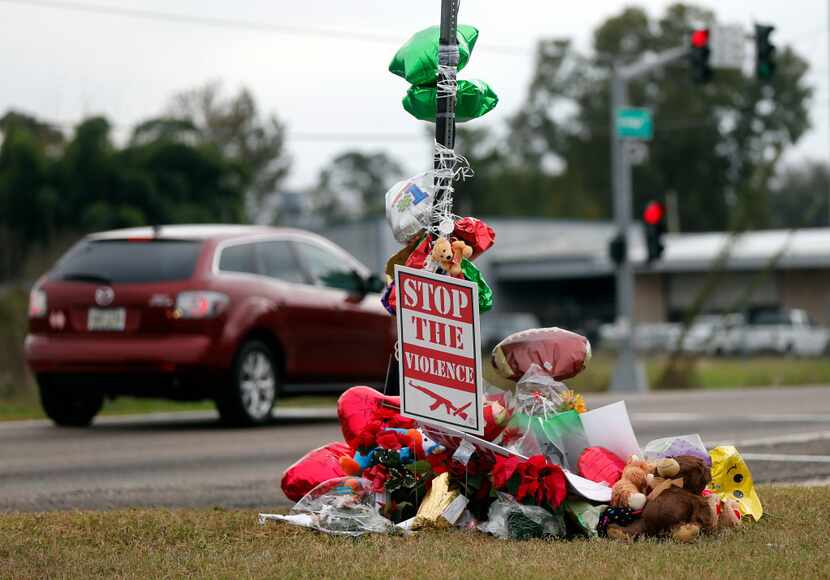 A memorial of flowers and balloons were placed at the site where ex-NFL player Joe McKnight...