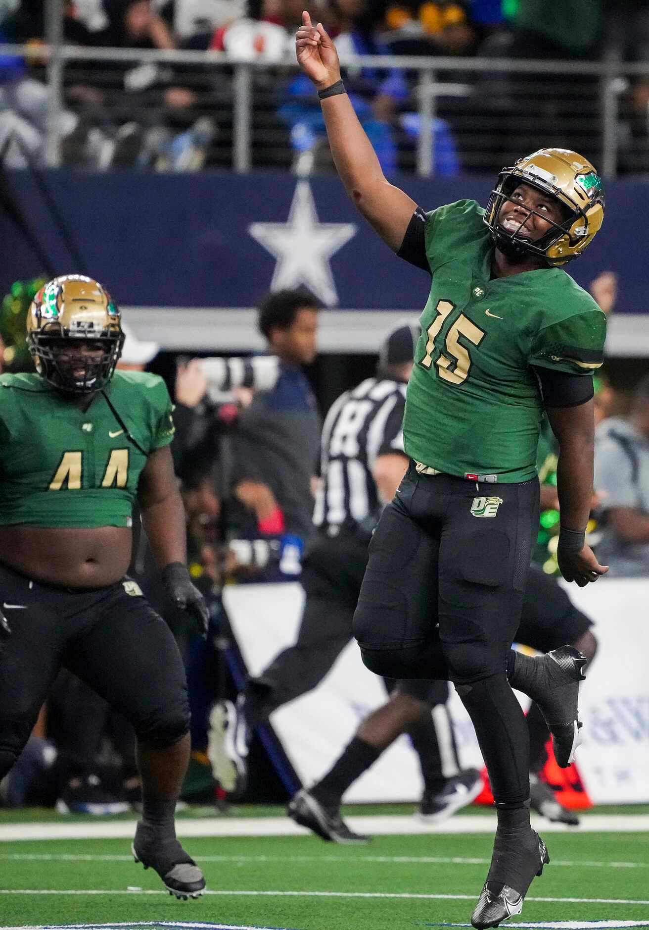 DeSoto quarterback Darius Bailey (15) celebrates after throwing a touchdown pass during the...