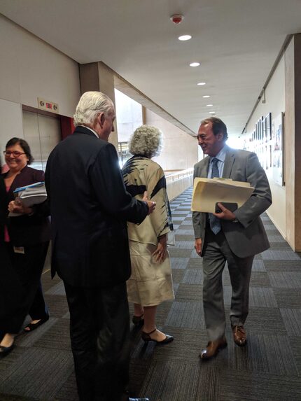 Ronald Holmes, at right, at Dallas City Hall  on Wednesday