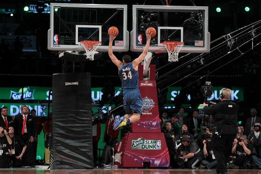LOS ANGELES, CA - FEBRUARY 19:  JaVale McGee #34 of the Washington Wizards dunks two balls...