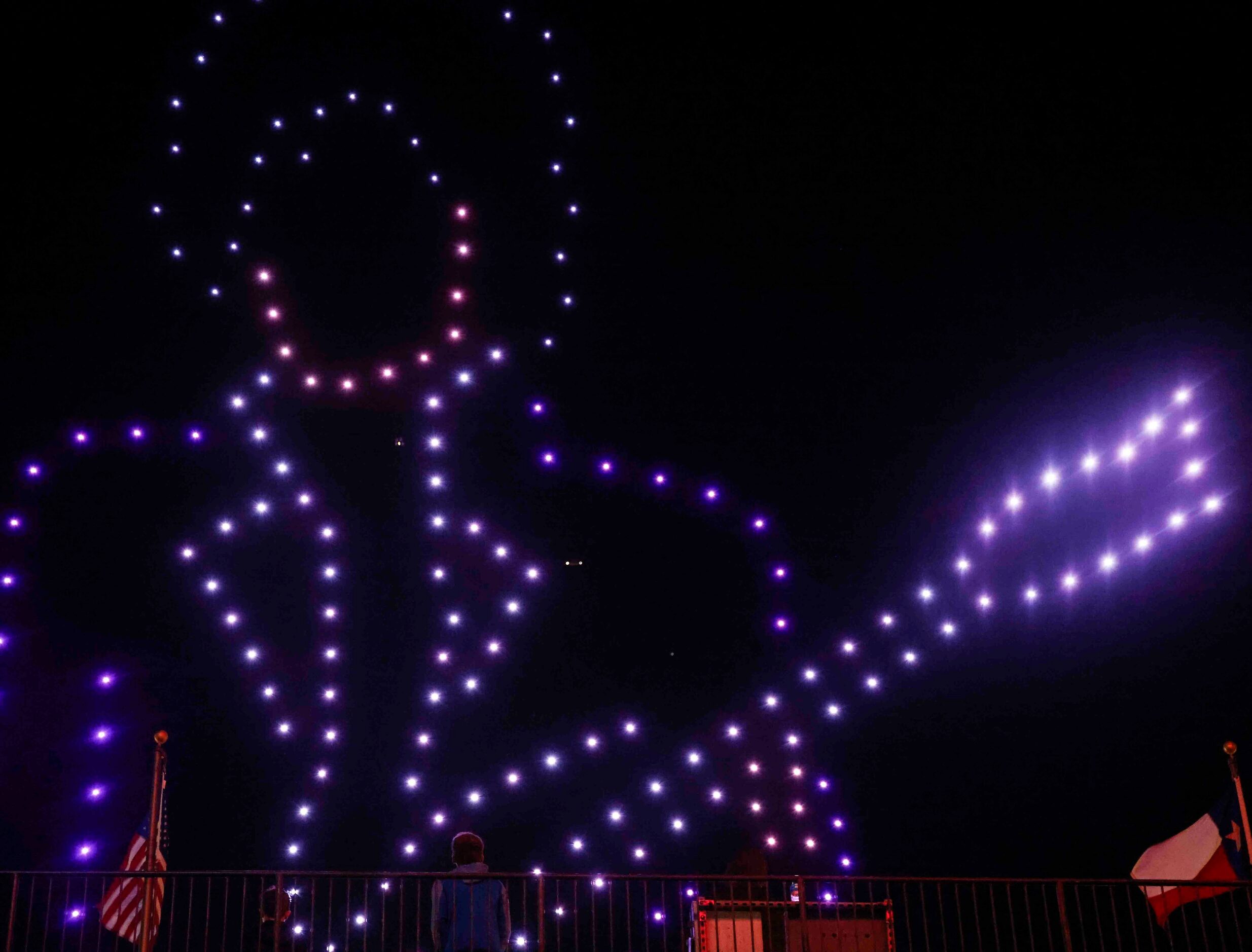 Crowd watches a live drone light show after an MLS soccer match on Saturday, March 4, 2023,...