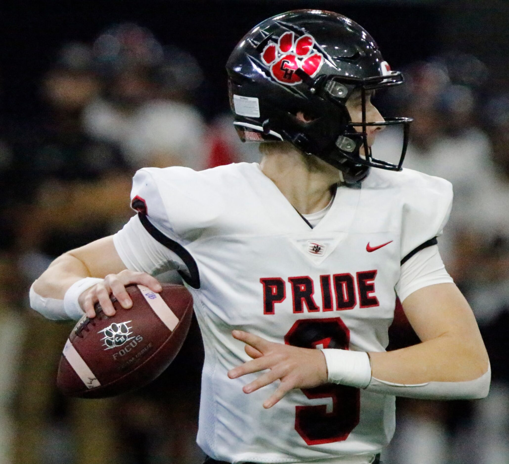 Colleyville Heritage High School quarterback A.J. Smith gets ready to throw a pass during...