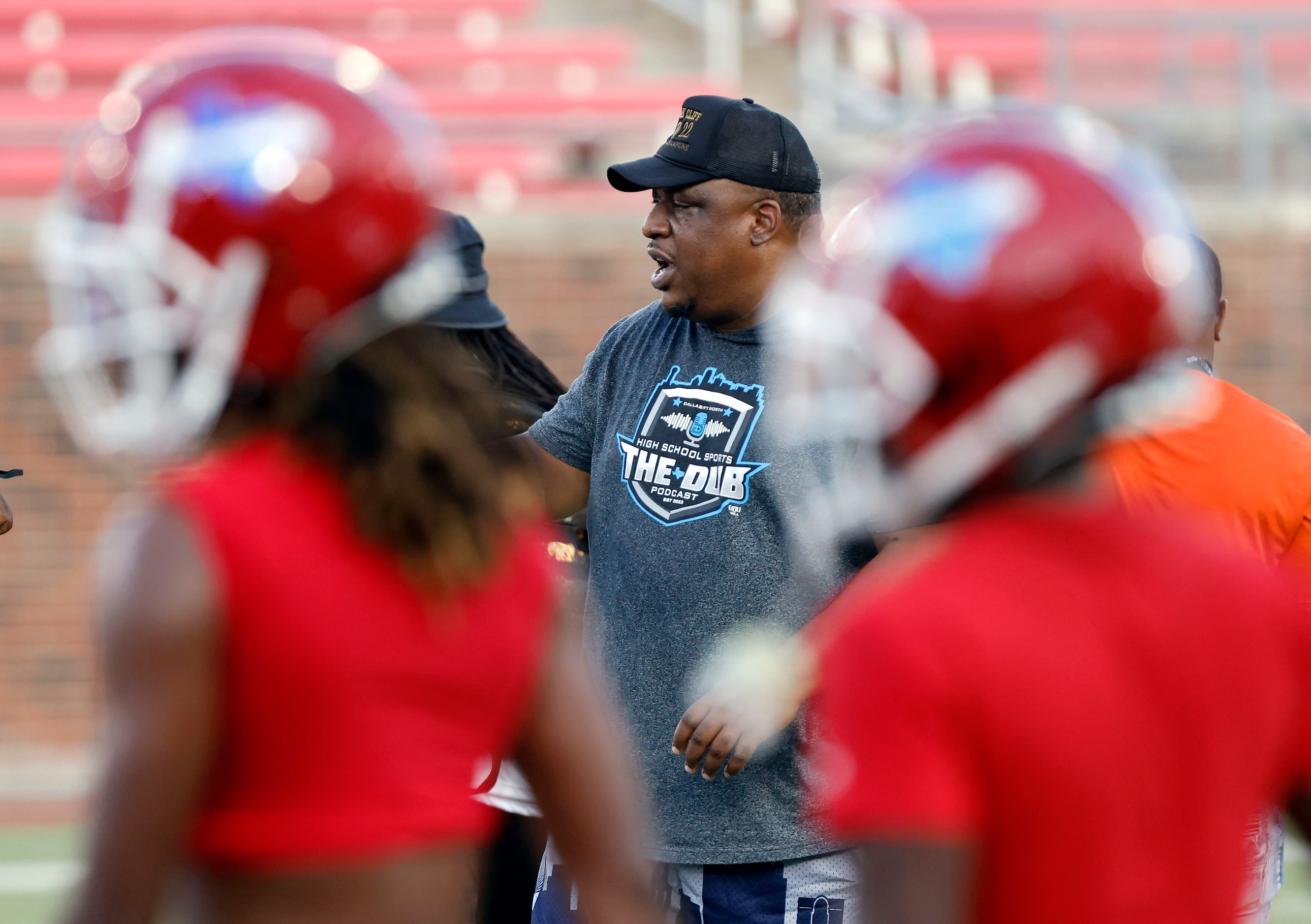 South Oak Cliff  head coach Jason Todd watches as his players warmup up before facing...