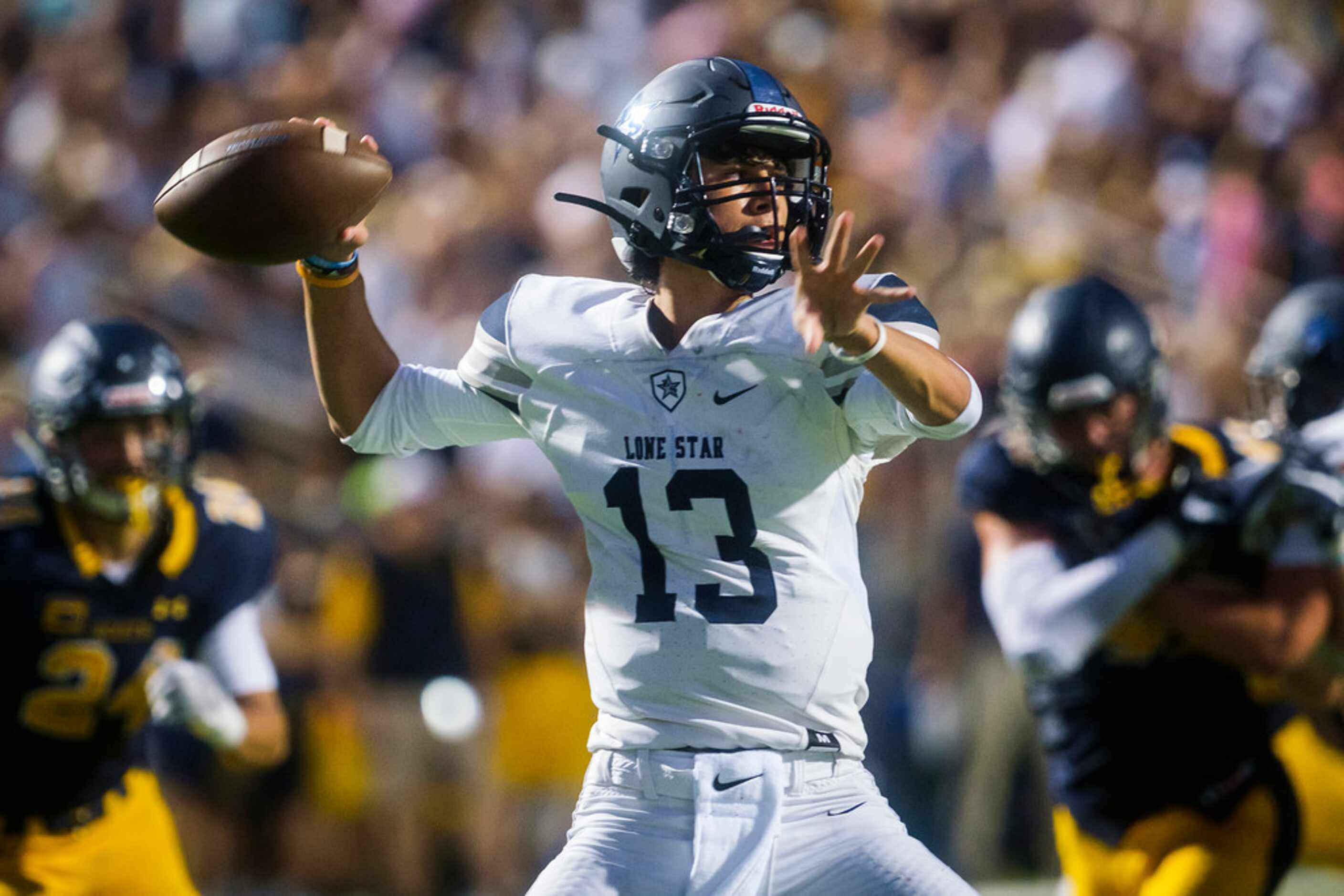 Frisco Lone Star quarterback Garret Rangel (13) throws a pass during the first half of a...