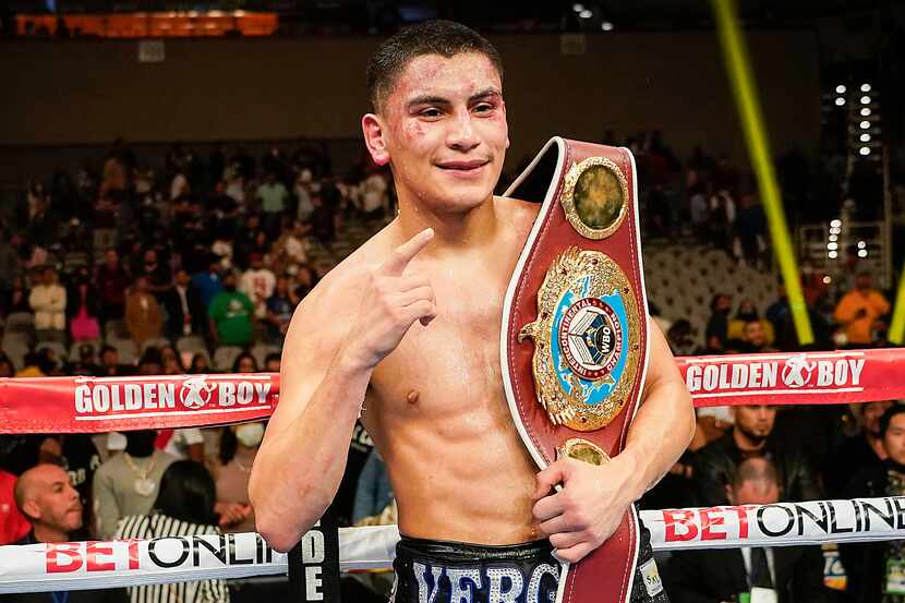 Vergil Ortiz Jr. celebrates with the title belt after knocking out Maurice Hooker in the...