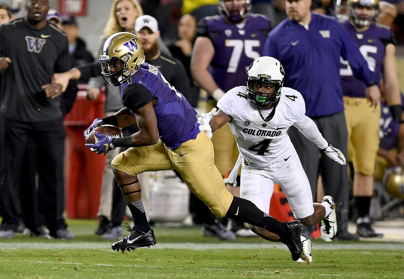 SANTA CLARA, CA - DECEMBER 02:  John Ross #1 of the Washington Huskies gets past Chidobe...