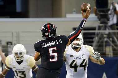 Texas Tech Red Raiders quarterback Patrick Mahomes (5) throws a second quarter touchdown as...