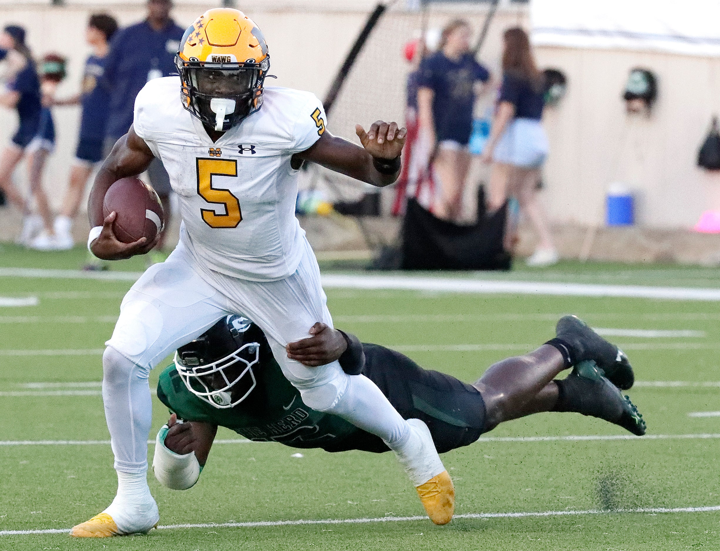 Berkner High School linebacker Richmond Ugochukwu (12) was unable to hand onto McKinney High...