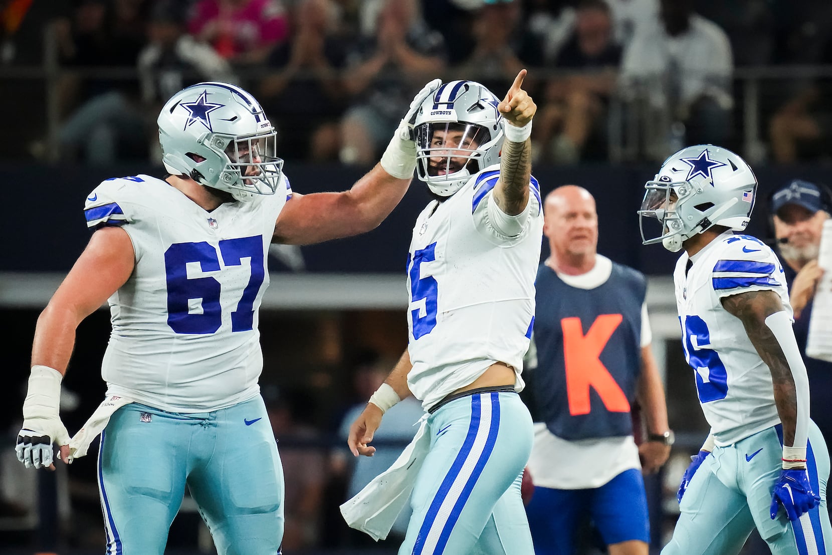 A Dallas Cowboys fan holds up a sign before an NFL football game against  the Raiders on Thursda …