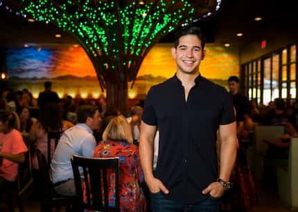 Julian Rodarte, who owns Beto & Son with his father, poses for a photo in the dining room in...