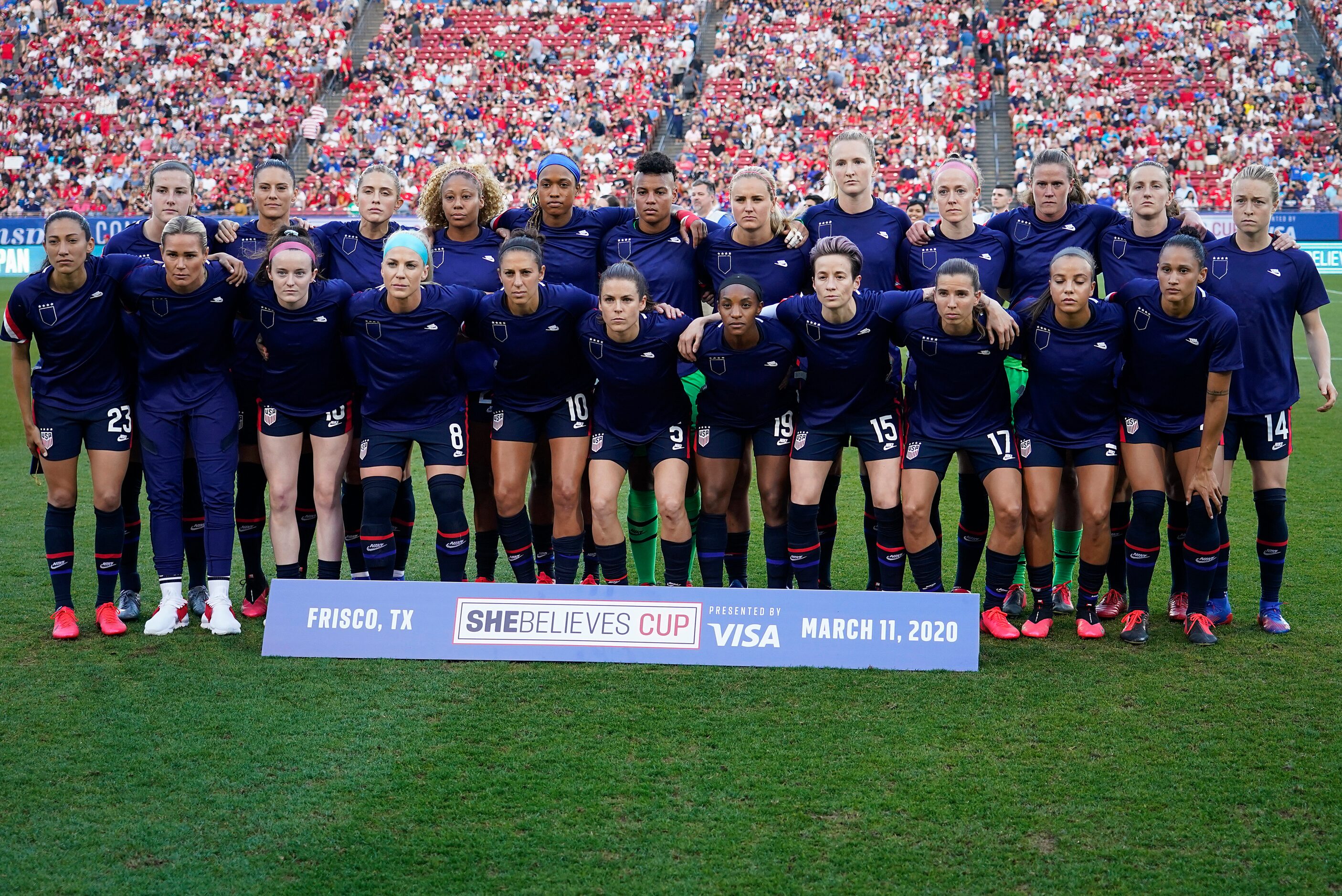 USA womenÕs national team members pose for a photos with their warmups turned inside out...