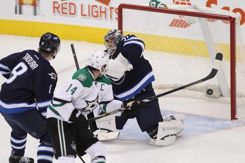 WINNIPEG, MB - OCTOBER 11: Ondrej Pavelev #31 of the Winnipeg Jets cannot stop the shot by...
