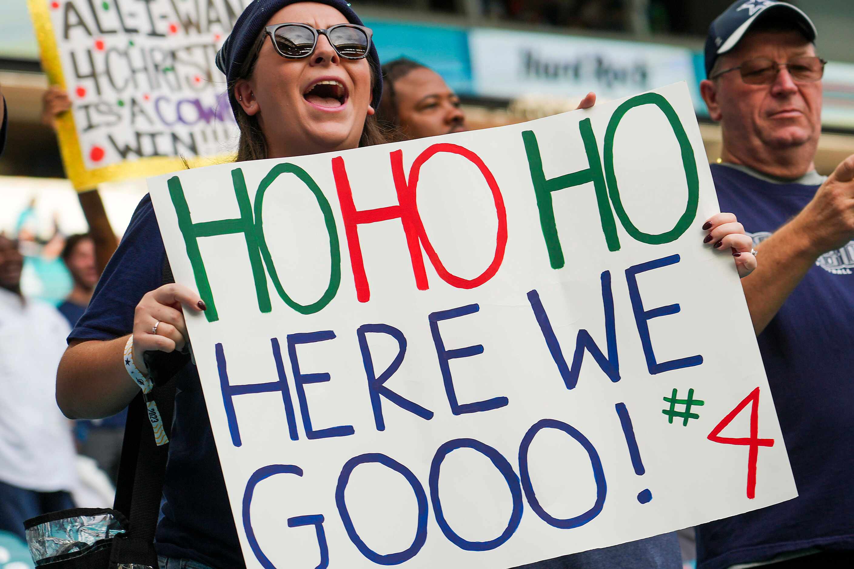 A Dallas Cowboys fan cheers as the team warms up before an NFL football game against the...