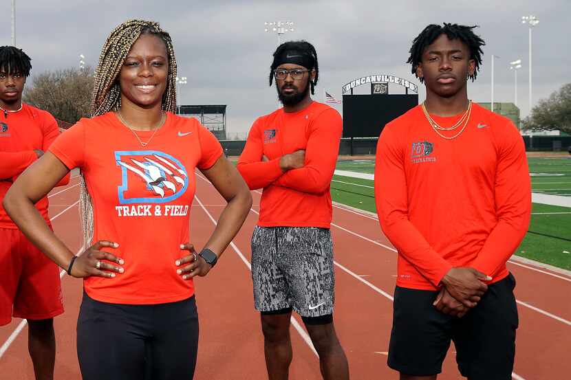 Duncanville boys sprint coach LaKeidra Stewart (center) is flanked by her 4x100 team, from...