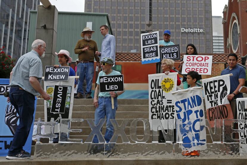 People protest across from the Morton H. Meyerson Symphony Center where the Exxon Mobil 2016...