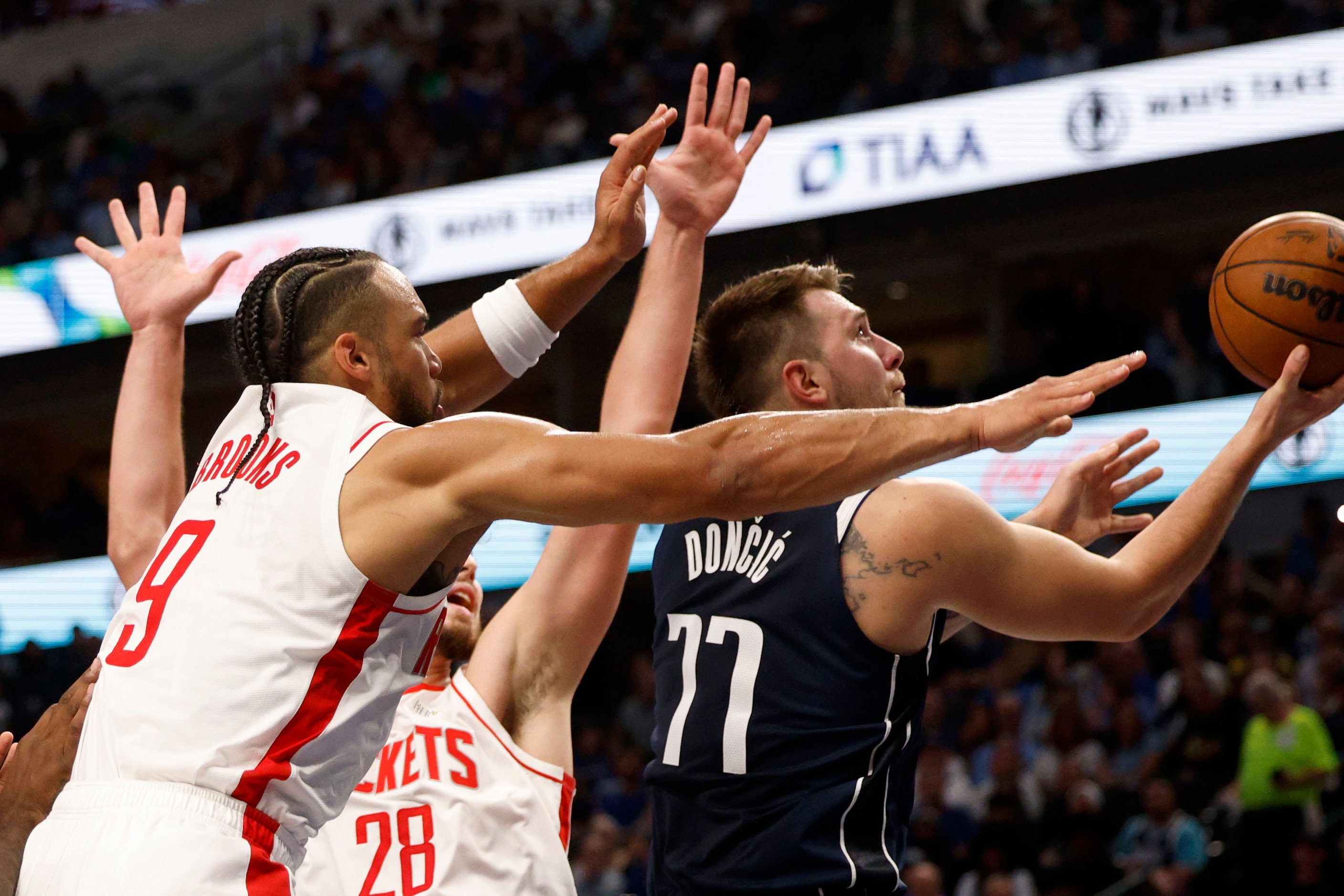 Dallas Mavericks guard Luka Doncic (77) goes to shoot the ball against Houston Rockets...