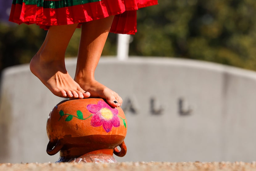 Yaretzi Flores performs with a cantoro during Day of the Dead celebration, on Saturday, Oct....