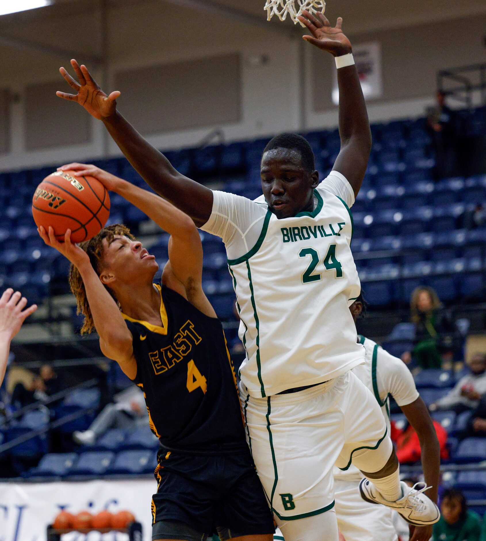 Birdville forward Joshua Zakaria (24) contests a shot attempt from Plano East guard Jordan...