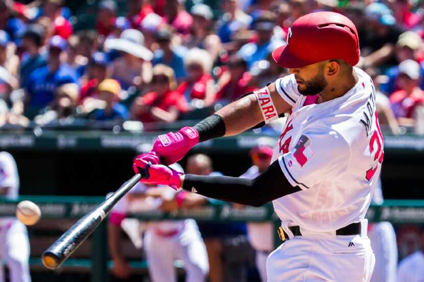 Texas Rangers right fielder Nomar Mazara (30) bats during the fifth inning of an MLB game...