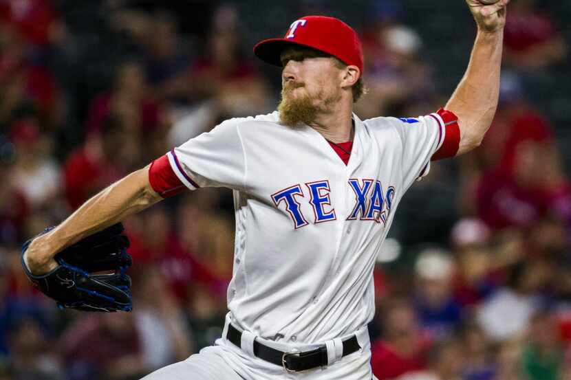 Texas Rangers relief pitcher Jake Diekman (41) pitches during the seventh inning of their...