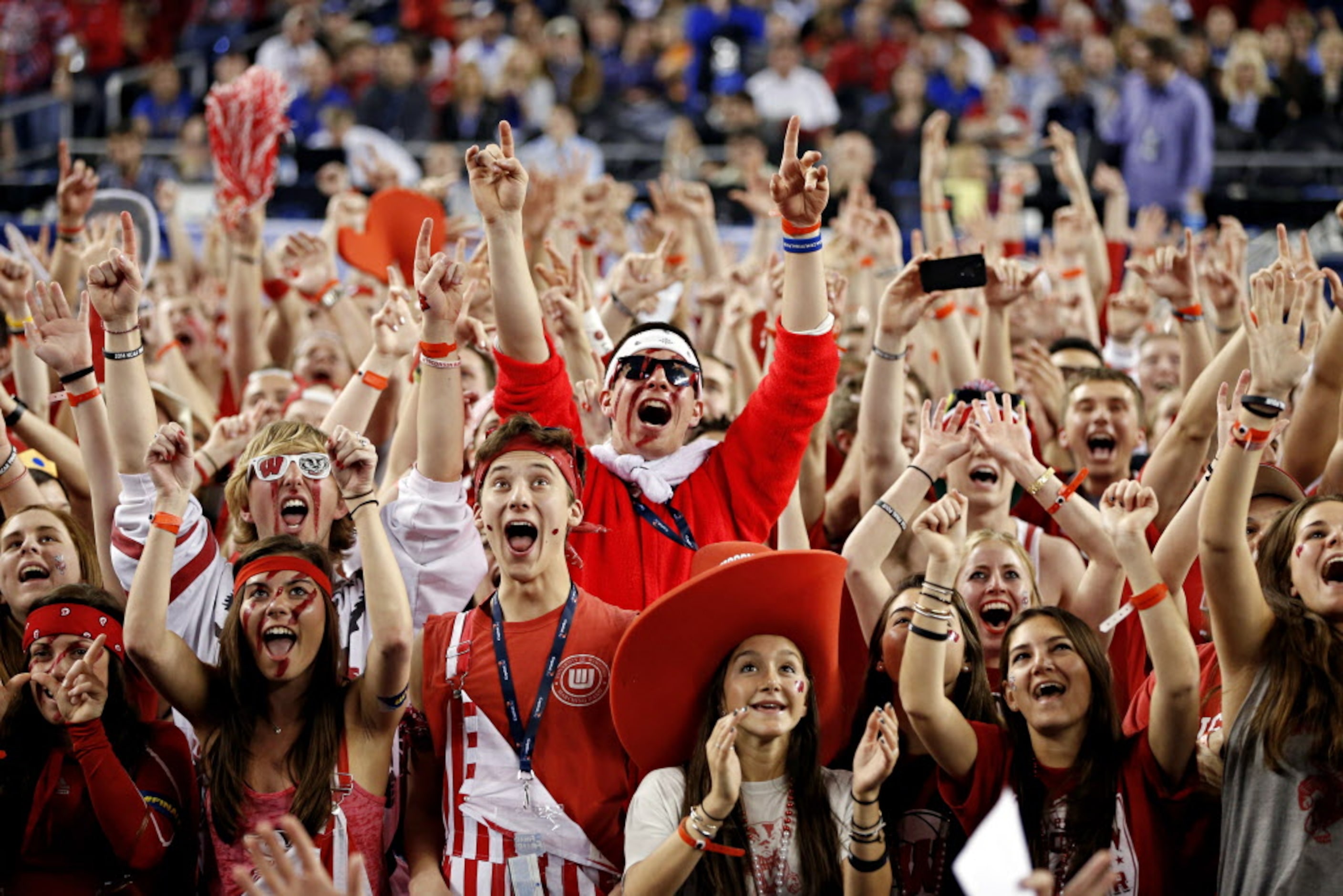 Wisconsin Badgers fans cheer before their game against the Kentucky Wildcats during the NCAA...