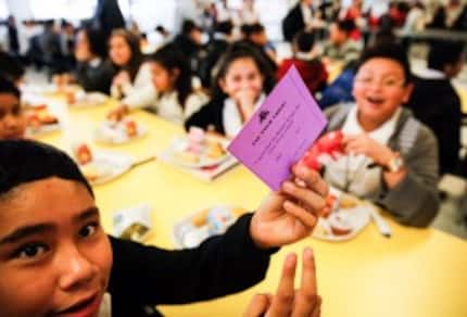  Students mark ballots Friday in the John B. Hood Middle School cafeteria. (Tom Fox/Staff...