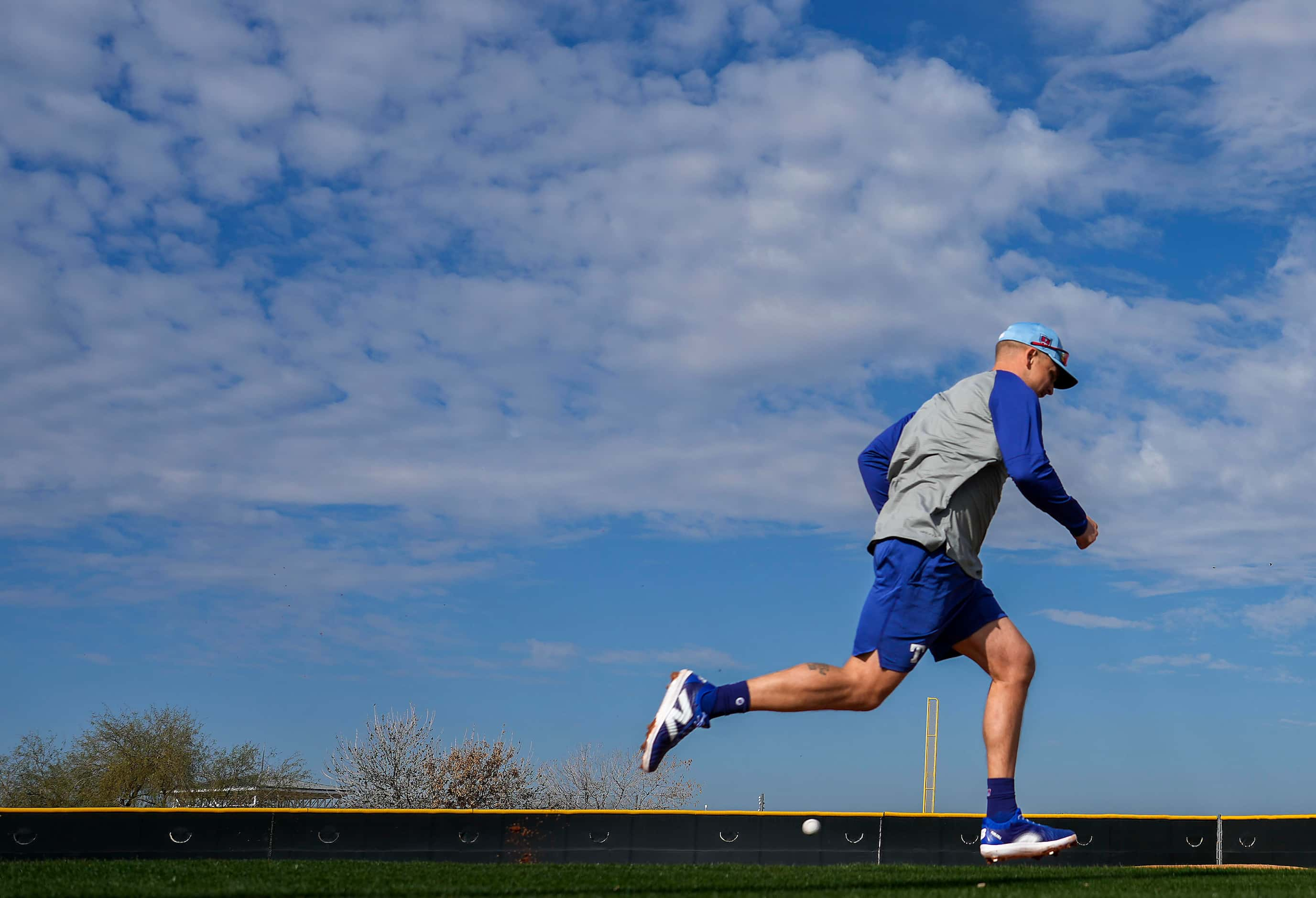 Texas Rangers infielder Nathaniel Lowe runs the bases during a spring training workout at...