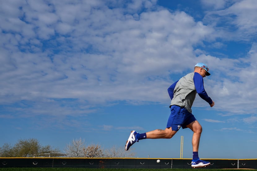 Texas Rangers infielder Nathaniel Lowe runs the bases during a spring training workout at...
